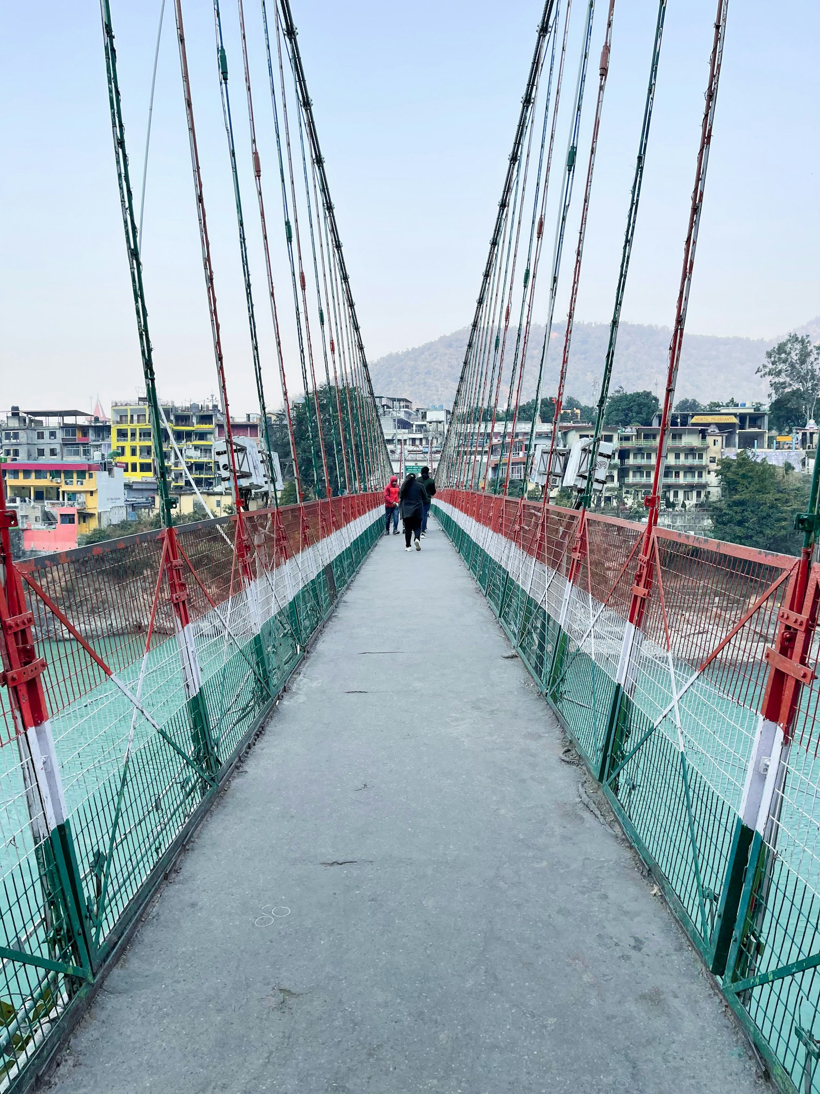 Walking across Lakshman Jhula suspension bridge