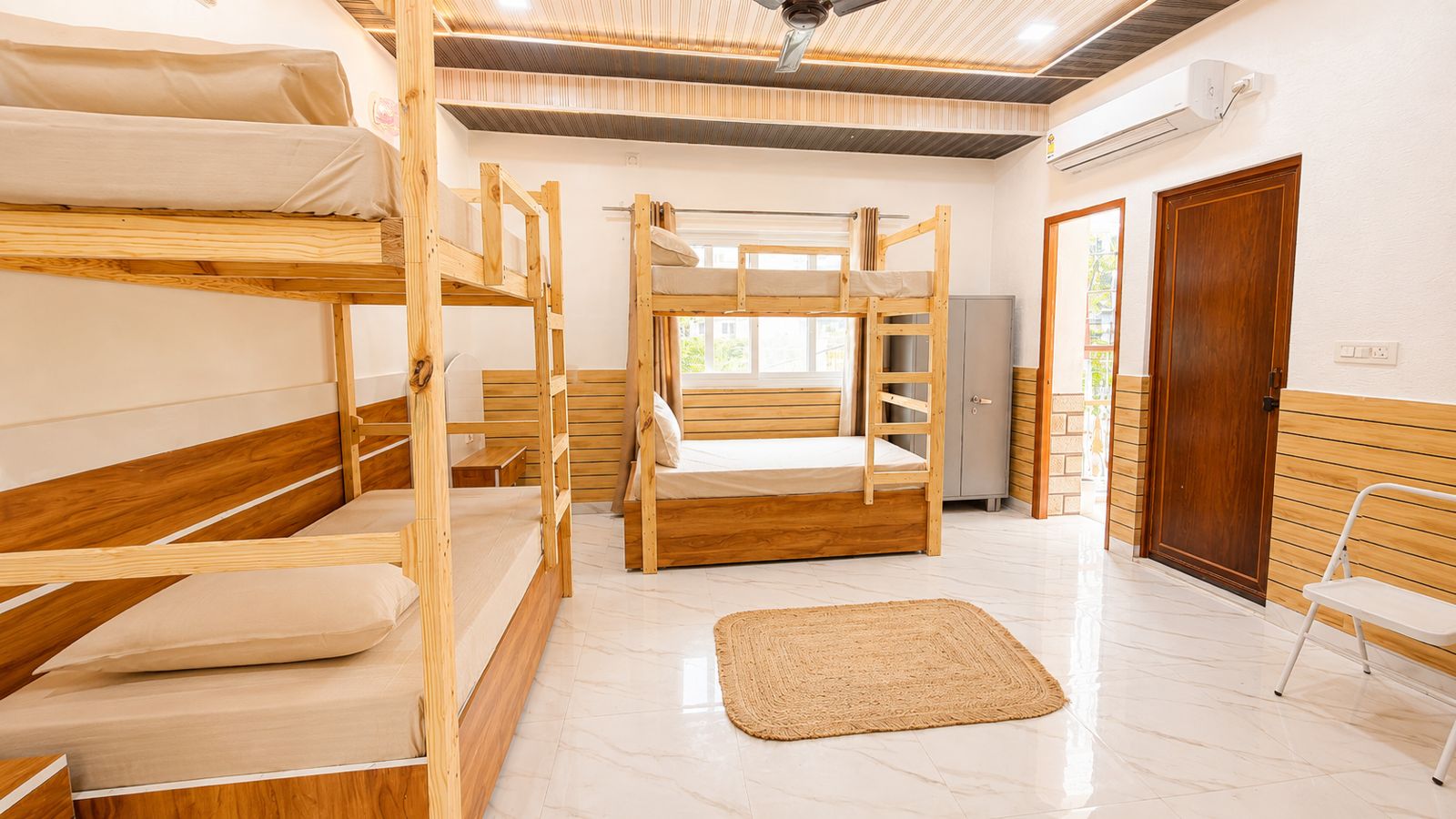 Bunk bed dorm room with bright flooring and wooden bunks