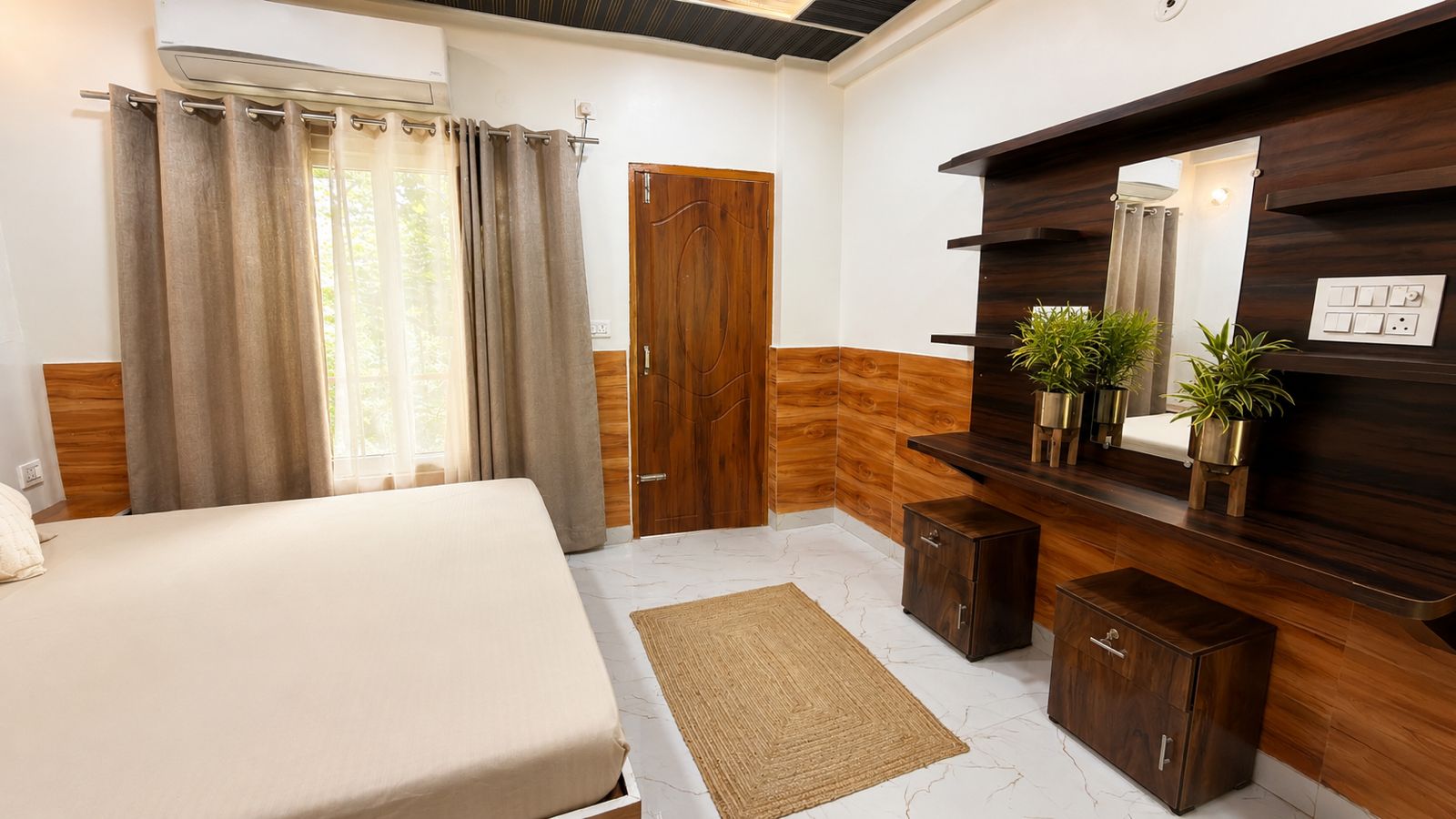 Private room with bed, window curtains, desk, and mirror