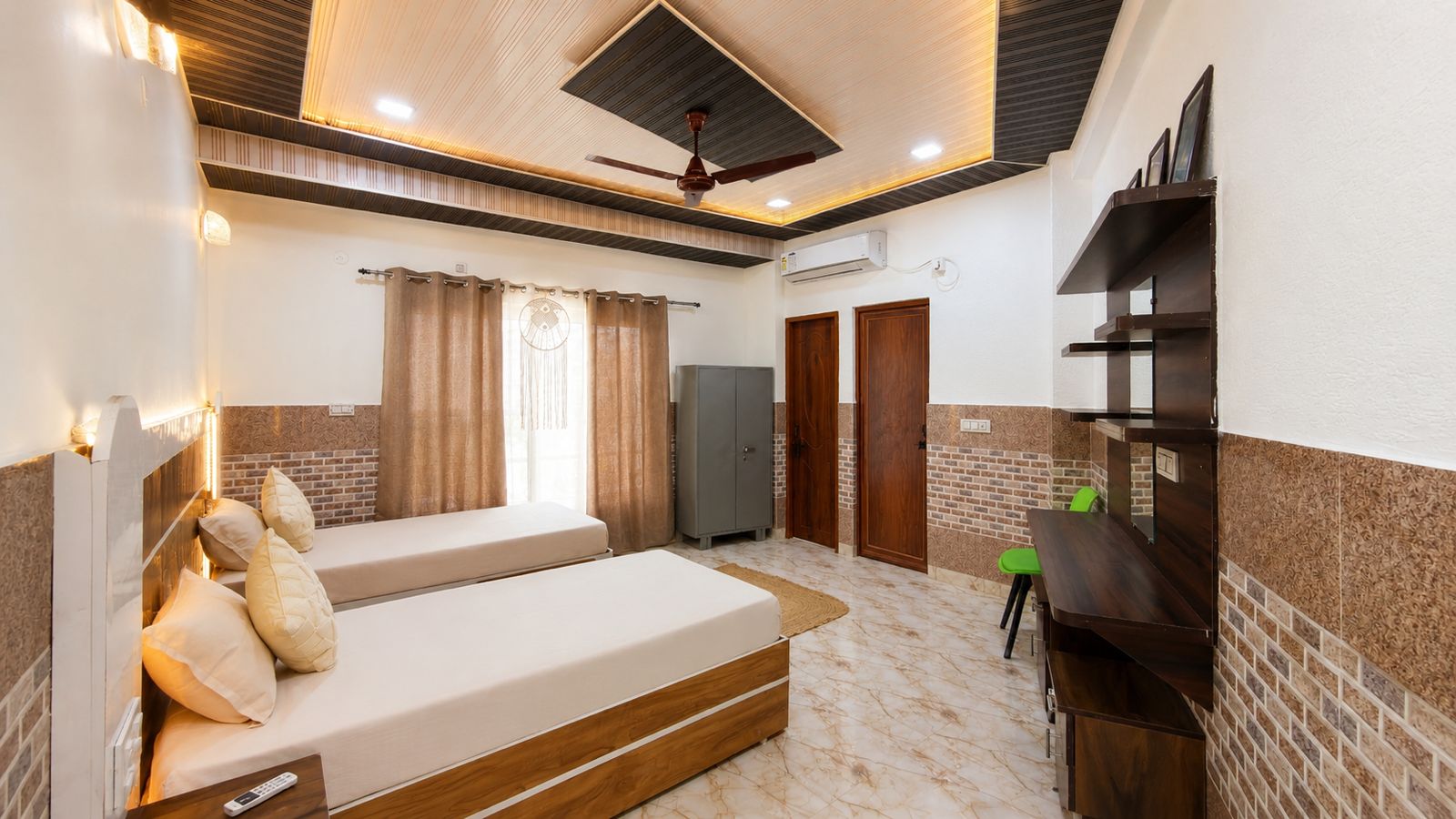 Twin bed room at Lily's Retreats with desk and AC